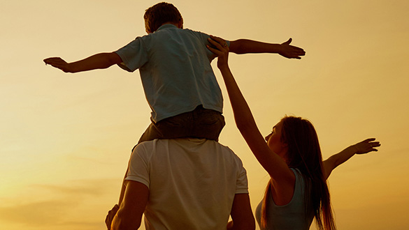 A family peacefully enjoying a sunset together, filled with joy and tranquility.